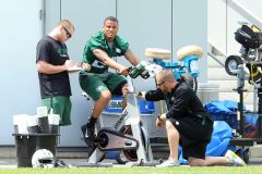 Dee Milliner rides the stationary bike