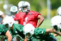 Geno Smith gets ready to run a play